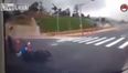 Video: Motorcyclist crashes off bike and then disappears down a hole in the road