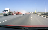 Video: Truck spills load into oncoming traffic