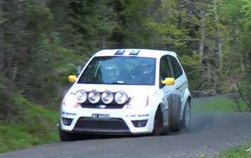 Video: Cameraman hit hard by runaway rally car wheel