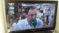 Check out the lad holding the ‘Up Cavan’ sign as Martin O’Neill is interviewed in Brazil
