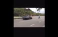 Video: Angry man throws a rock at a passing Lamborghini