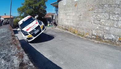 Video: The closest of close calls as this rally car goes up on two wheels around a corner