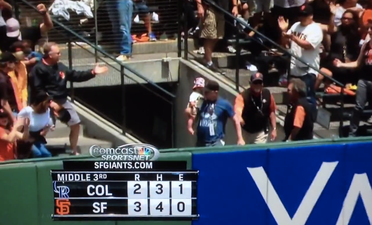 Video: Baseball fan catches home run ball while holding baby daughter