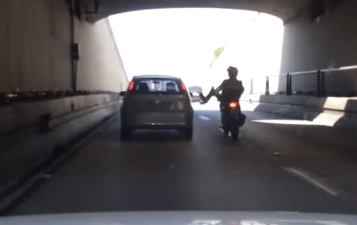Video: Road Raging motorcyclist gets his just deserts
