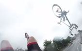 Video: Wow! This cyclist crashed into a car, flipped through the air and landed perfectly on his feet