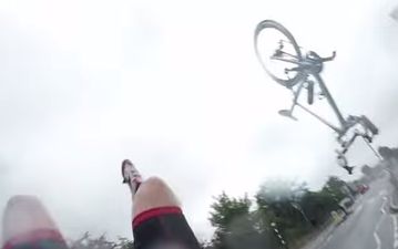 Video: Wow! This cyclist crashed into a car, flipped through the air and landed perfectly on his feet