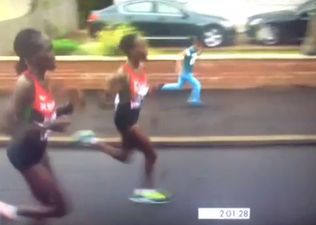 Vine: Little boy joins in with the marathon runners at Commonwealth Games
