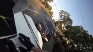 Video: Biker lands on car roof after being hit from behind