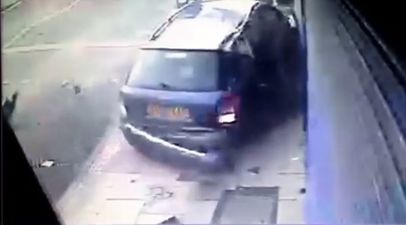 Video: Woman cheats almost certain death as car mounts pavement & plunges into lamp post beside her