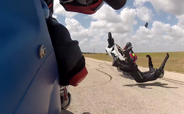 Video: Motorbike crash sees two riders flying over their handlebars