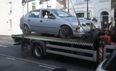 Video: British bloke drives car off removal truck in attempt to avoid fine