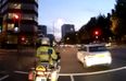 Video: London driver runs a red light; immediately caught out by police motorbike driving right alongside the car