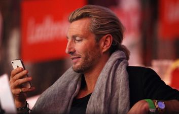 What a legend: Robbie Savage treats young cancer patient to a spin in his Ferrari