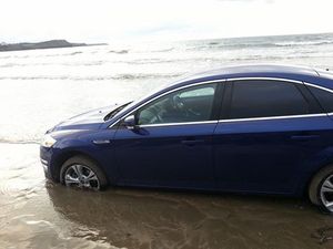 Pics: Two more cars have been caught in the tides on a Donegal beach tonight