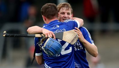 Pic: Podge Collins consoles Clare team-mate Donal Tuohy after Cratloe beat Crusheen