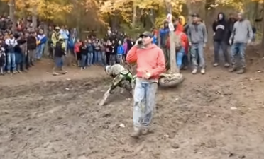 Video: Motocross spectator jumps over rider while taking a phone call