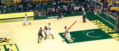Video: Mayhem after guy makes a 75-foot basket in the last second to win a college game