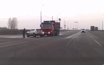 Video: Russian pedestrian gets caught in the middle of nasty crash