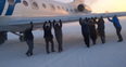 Video/Pic: Watch as Russian passengers actually push a plane down a runway in -52C