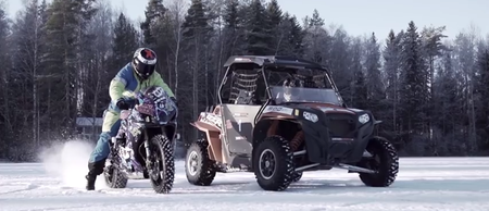 Video: A motorbike and ATV drift around a frozen lake in this incredible display of driving
