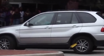 Video: Homer Simpson would be proud of this clamped BMW driver