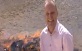 Video: BBC journalist gets a little giddy while standing beside pile of burning drugs