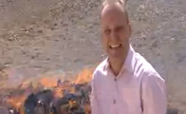 Video: BBC journalist gets a little giddy while standing beside pile of burning drugs