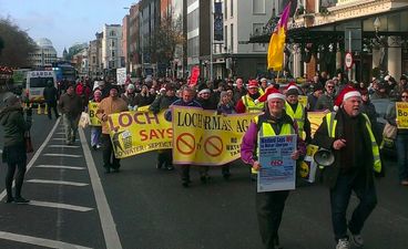 Pic: Best picture taken at yesterday’s protest features a lad doing a handstand in front of laughing Gardaí