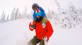 Video: A dad snowboarding down a mountain with his son on his shoulders