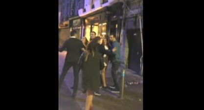 Video: Busker in Galway keeps singing despite a scrap breaking outside beside him