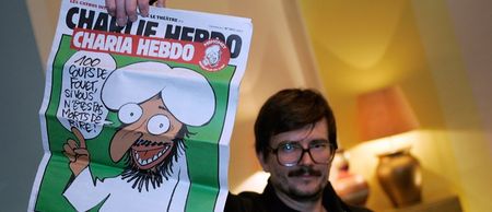 12 people reported dead after shootings at offices of a satirical magazine in Paris