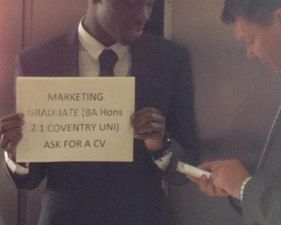 Man who held this sign up at train station returns with good news