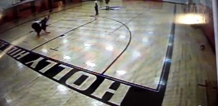 Video: Cowardly man bodyslams a female teacher to the ground during a basketball match