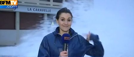 Video: Wipeout! Female reporter gets washed away by giant wave on live TV