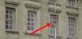 Video: Insane footage of a naked man climbing down the side of Buckingham Palace and falling