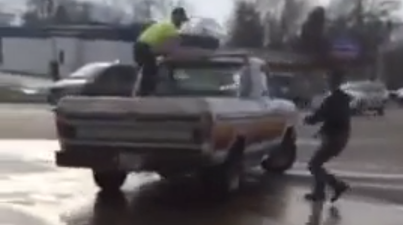 Video: Brave stuntman stops out of control truck in car park