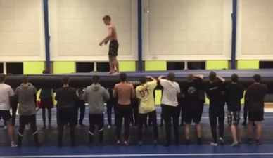 Vine: Gymnast lands massive quadruple backflip with the help of 26 friends