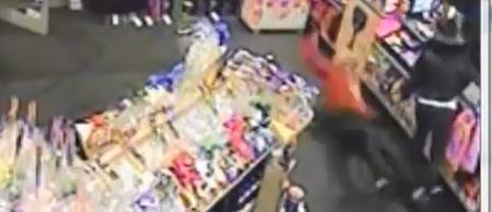 Video: Armed robber slips, falls and loses his disguise while holding up a Belfast off-licence