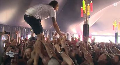 Video: Singer crowdwalks, catches beer, drinks it, throws it away, is a God