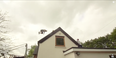 Video: Watch this guy somersault over his house using a swing