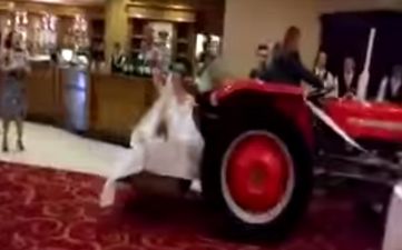 Video: Bride arrives to her wedding reception in Sligo in a transport box on the back of tractor