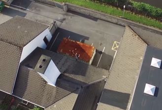 Video: Drone quadcopter films kids running on Letterkenny school rooftop