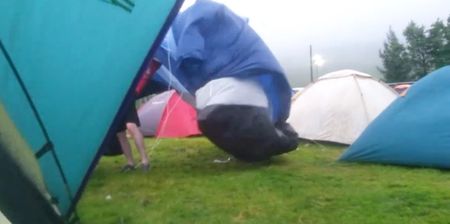 Video: Irish lad tries to save his tent at music festival as storm starts blowing it away