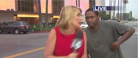Video: This man scaring the bejesus out of a news reporter on live TV is comedy gold