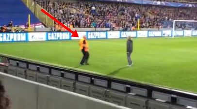 VIDEO: Steward at Manchester United game tries to stop pitch invader and fails miserably
