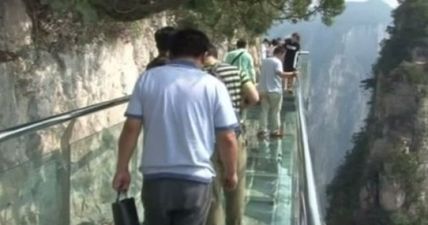PIC: This terrifying glass walkway 3,500 ft up a cliff in China has started cracking under tourists’ feet