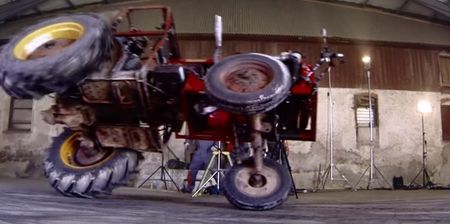 VIDEO: Guy flips a tractor trying to do a ridiculous drift in a warehouse