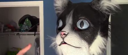 VIDEO: Man scares the sh*t out of his cats by wearing an unsettling cat mask
