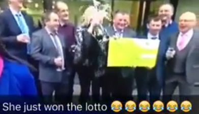 VIDEO: Lotto winner sprays herself in the face with champagne on Six One news