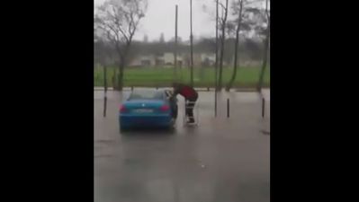 VIDEO: Genius Waterford shopper uses trolley to avoid getting wet while entering his car in flooded car park